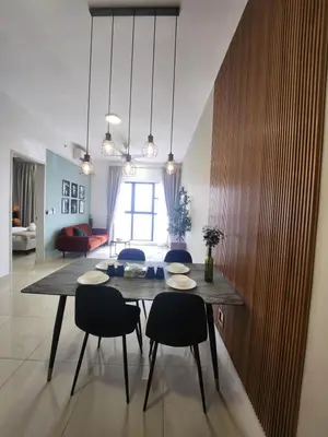 a dining room with a table and chairs at TRION Grand Service Suites at KL in Kuala Lumpur