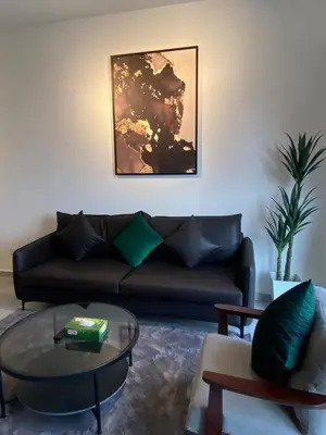 a living room with a couch and a glass table at AGILE Galaxy Suite in Kuala Lumpur