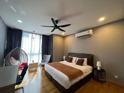 a bedroom with a bed and a ceiling fan at KL Gateway Residence Bangsar by The Luxe in Kuala Lumpur