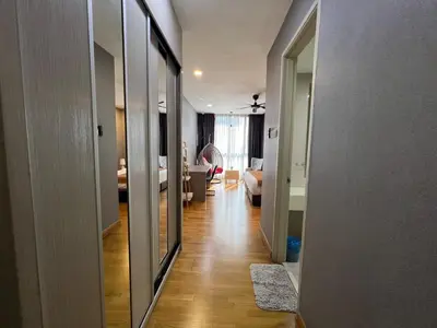 a hallway leading to a room with a living room at KL Gateway Residence Bangsar by The Luxe in Kuala Lumpur