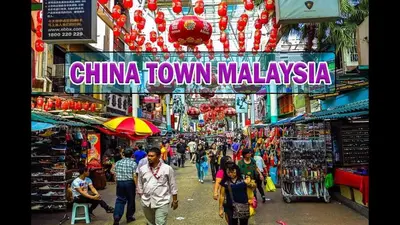 a group of people walking down a street in a market at KL Gateway Residence Bangsar by The Luxe in Kuala Lumpur