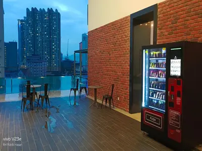 a drink vending machine sitting on top of a building at Starlight Suite At Chambers Kuala Lumpur KLCC in Kuala Lumpur