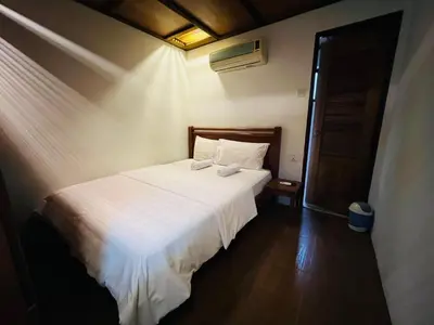 a bedroom with a white bed in a room at Iviillainn in Kuala Lumpur