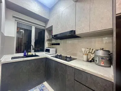 a kitchen with a sink and a counter top at Homestay Inspirasi in Kuala Lumpur