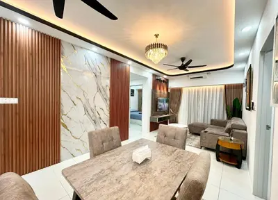 a living room with a table and a couch at Homestay Inspirasi in Kuala Lumpur
