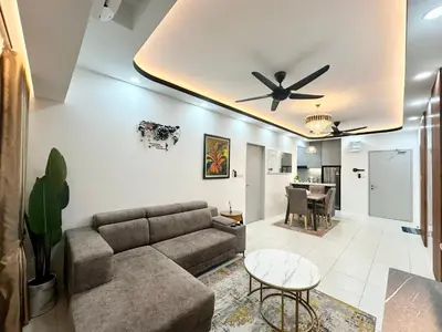 a living room with a couch and a ceiling fan at Homestay Inspirasi in Kuala Lumpur