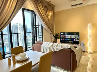 a living room with a couch and a table at 9 Pax 3R3B Trion KL City View 10Mins to KLCC in Kuala Lumpur