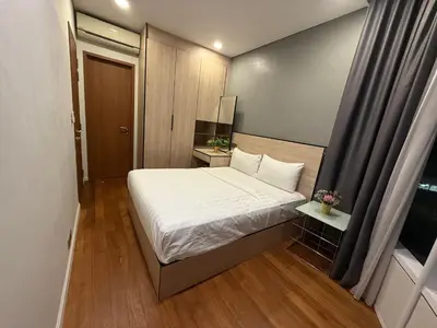 a small bedroom with a bed and a window at Sky Premium suites klcc in Kuala Lumpur