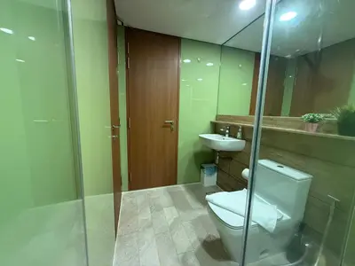 a bathroom with a toilet and a sink at Sky Premium suites klcc in Kuala Lumpur