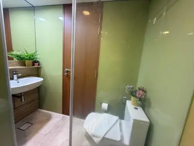 a bathroom with a shower and a toilet and a sink at Sky Premium suites klcc in Kuala Lumpur