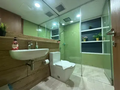 a bathroom with a sink and a toilet and a shower at Sky Premium suites klcc in Kuala Lumpur