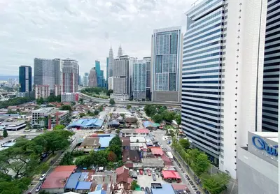a view of a city with buildings and cars at The colony by Klcc view sweet home in Kuala Lumpur