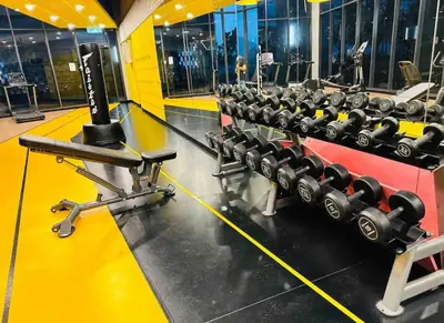 a row of dumbbells in a gym at Mini studio Neu suites KLCC in Kuala Lumpur