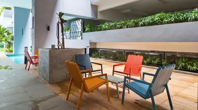 a group of chairs and tables in a building at Private Room Queen Size KLCC in Kuala Lumpur