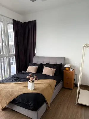 a bedroom with a large bed with flowers on it at Sentrio Pandan Kuala Lumpur KLCC KL Tower TRX 10 in Kuala Lumpur