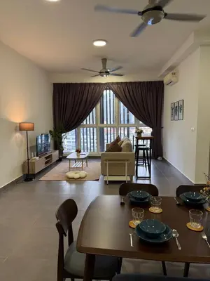 a living room with a table and chairs and a couch at Sentrio Pandan Kuala Lumpur KLCC KL Tower TRX 10 in Kuala Lumpur