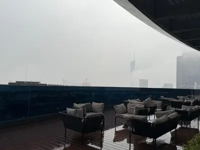 a group of chairs on the roof of a building at Eaton Premier Suite KLCC in Kuala Lumpur