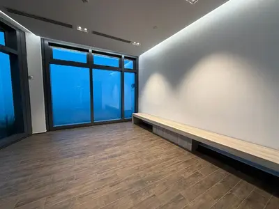 a empty room with a bench and windows at Eaton Premier Suite KLCC in Kuala Lumpur