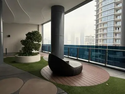a building with a large window with a tire on the floor at Eaton Premier Suite KLCC in Kuala Lumpur