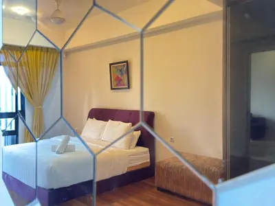 a bedroom with a bed and a mirror at XING LUN KLCC Anggun residents in Kuala Lumpur