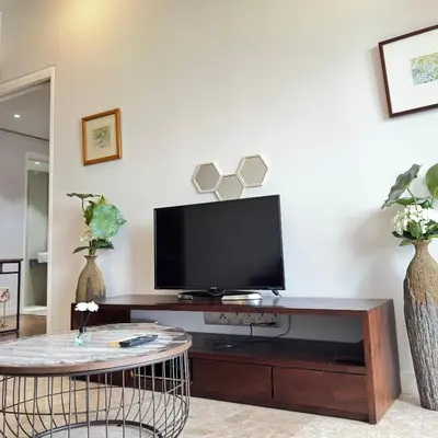 a living room with a flat screen tv on a table at XING LUN KLCC Anggun residents in Kuala Lumpur