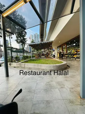 a restaurant hall with a view of the city at The Robertson Residence Kuala Lumpur with City views in Kuala Lumpur