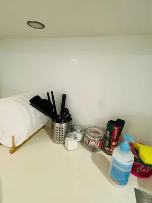 a counter with a counter top with utensils and medicines at URBAN COZY HOME at SkySuites Near KLCC Complimentary Breakfast in Kuala Lumpur