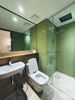a bathroom with a toilet and a sink and a shower at URBAN COZY HOME at SkySuites Near KLCC Complimentary Breakfast in Kuala Lumpur