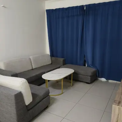 a living room with a couch and a table at One Bedroom Apartment at Kuala Lumpur in Kuala Lumpur