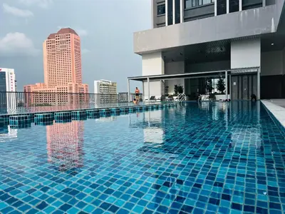 a large swimming pool on top of a building at Chamber KL Residence by Moon Orchid in Kuala Lumpur
