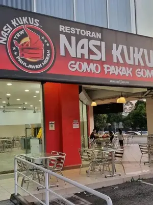 a restaurant with tables and chairs in front of it at RumaDuke Kuala Lumpur with Netflix and KLCC Views in Kuala Lumpur