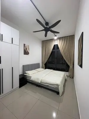 a bedroom with a bed and a ceiling fan at RumaDuke Kuala Lumpur with Netflix and KLCC Views in Kuala Lumpur