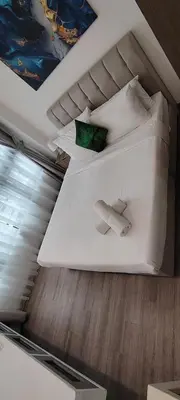 a bed with white pillows in a room at KLCC Agile Residences By Bukit Bentang Pevilion With Trx in Kuala Lumpur