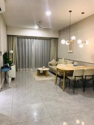 a living room with a table and a couch at KLCC Agile Residences By Bukit Bentang Pevilion With Trx in Kuala Lumpur