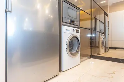 a laundry room with a washer and dryer at Dorsett Residence Kuala Lumpur #21 in Kuala Lumpur