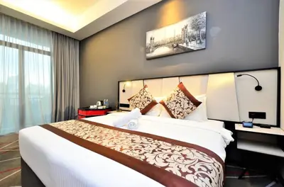 a bedroom with a large bed in a room at Red M101 Dang Wangi By Oak Tree in Kuala Lumpur