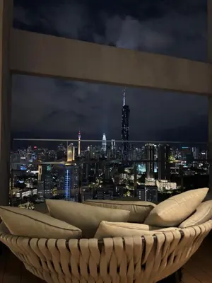 a room with a view of a city at night at Riveria City in Kuala Lumpur
