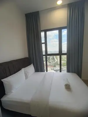 a bedroom with a large white bed with a large window at Trion Residence Kuala Lumpur by Azure in Kuala Lumpur