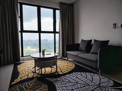 a living room with a couch and a table in front of a window at Trion Residence Kuala Lumpur by Azure in Kuala Lumpur