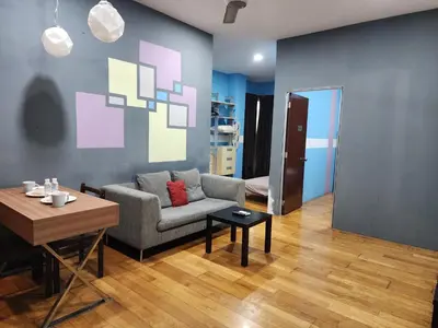 a living room with a couch and a table at Regalia residence KLCC By Glory Homes in Kuala Lumpur
