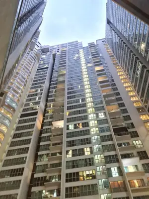 a tall building with many windows in a city at Regalia residence KLCC By Glory Homes in Kuala Lumpur