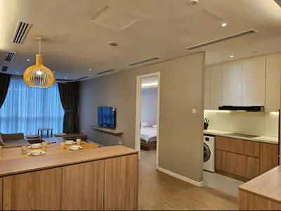 a room with a kitchen and a living room at Binjai 8 KLCC in Kuala Lumpur