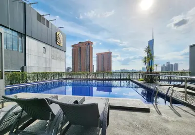 a swimming pool on the roof of a building at Bukit Bintang Fairlane Residence #81 Pavilion Kuala Lumpur in Kuala Lumpur