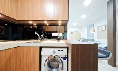 a kitchen with a washing machine in a kitchen at Bintang Fairlane Residence #83 KLCC Pavilion in Kuala Lumpur