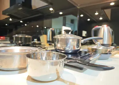a group of pots and pans sitting on a counter at Bintang Fairlane Residence #83 KLCC Pavilion in Kuala Lumpur