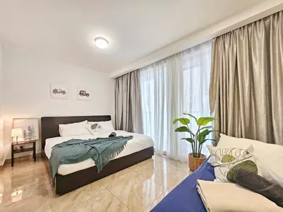 a bedroom with two beds and a large window at Bukit Bintang Fairlane Residence #199 KL TRX Pavilion in Kuala Lumpur