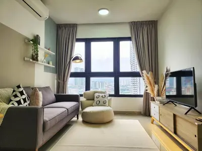 a living room with a couch and a tv at Family Suite M Vertica Sunway Velocity Ikea KL MRT in Kuala Lumpur