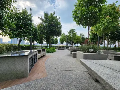 a park with benches and trees and trees at Family Suite M Vertica Sunway Velocity Ikea KL MRT in Kuala Lumpur