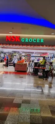a nxk grocery store with a nxk cheaper sign at KL Marigold Apartment At Times Square in Kuala Lumpur