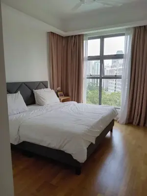 a bedroom with a large bed and a large window at Luxury Balcony Suites- Homestay in Kuala Lumpur